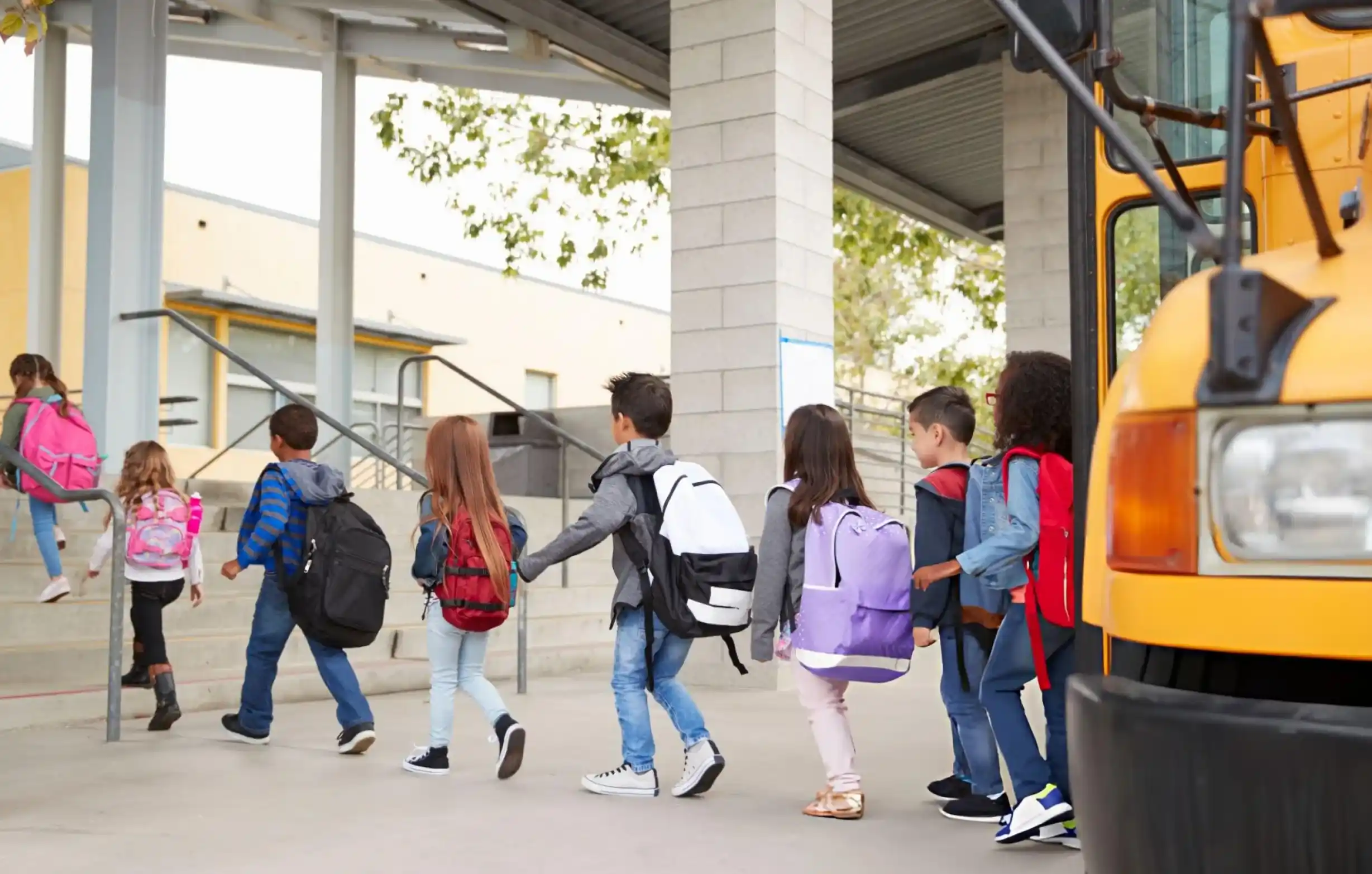 Students safely getting off a school bus